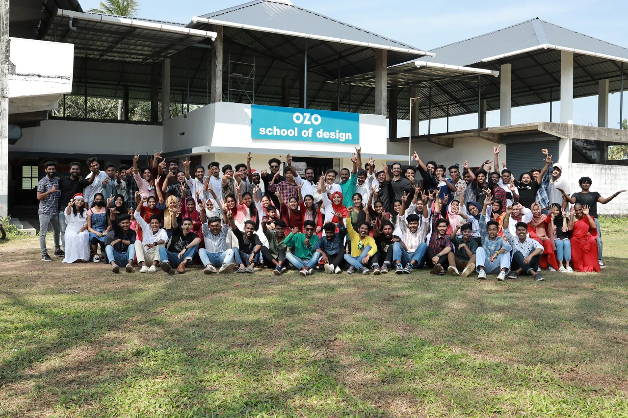 Students and faculty of OZO School of Design gathered outside the campus building