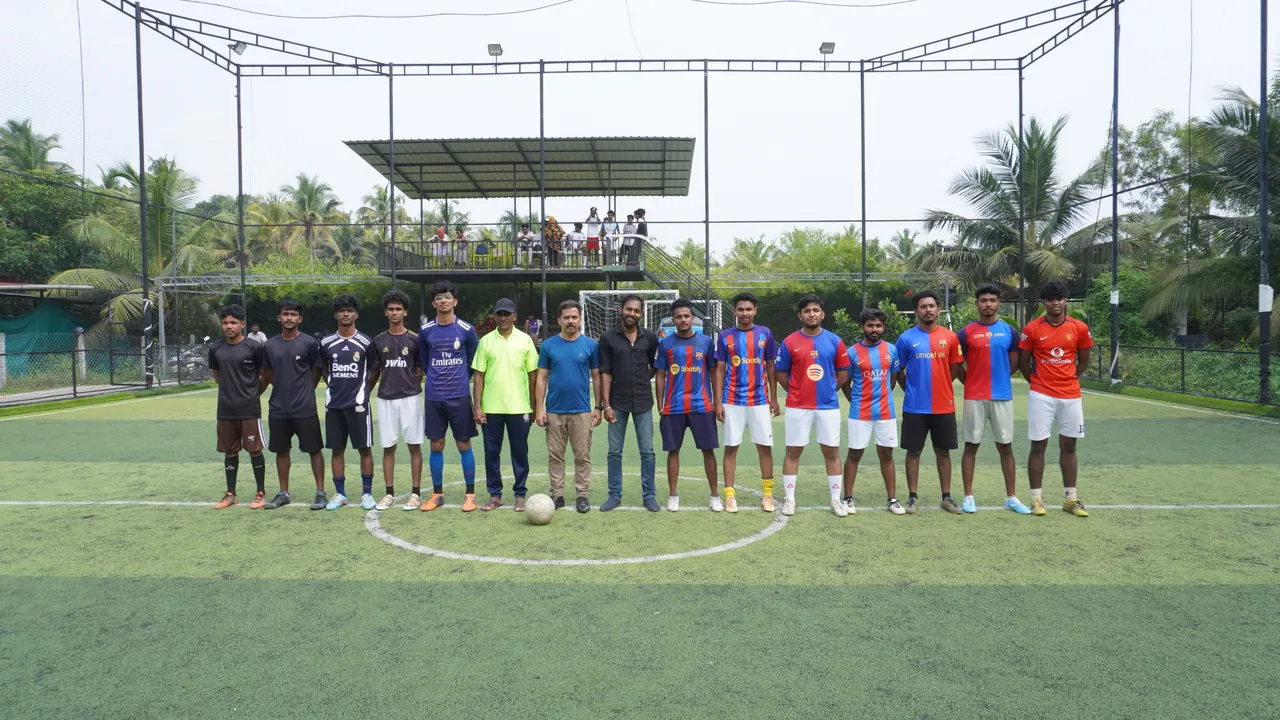 Two football teams lined up across the turf