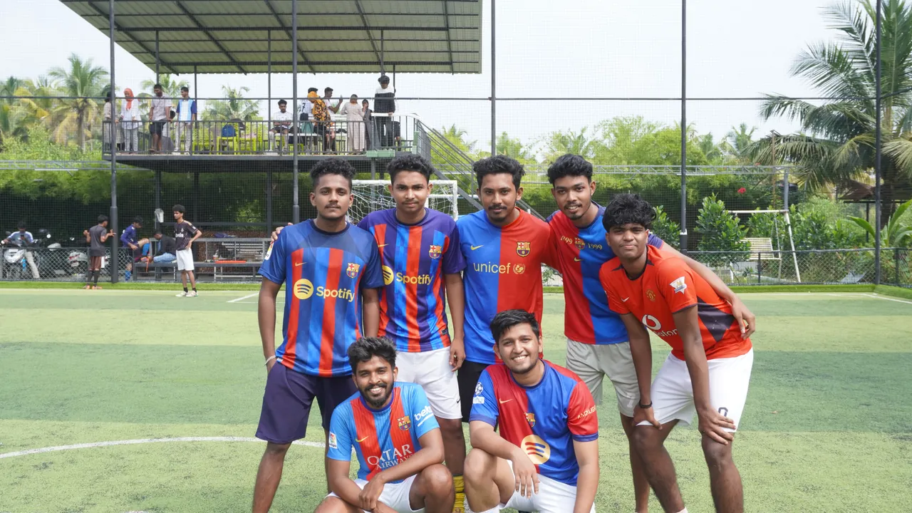 An OZO football team posing on the turf