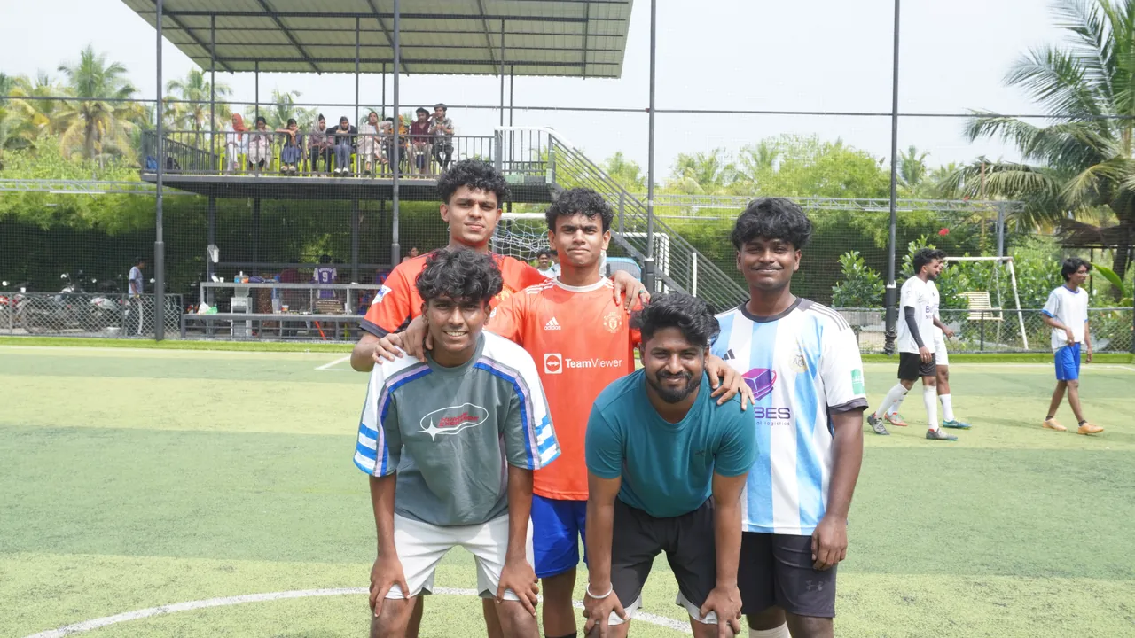 An OZO football team posing on the turf