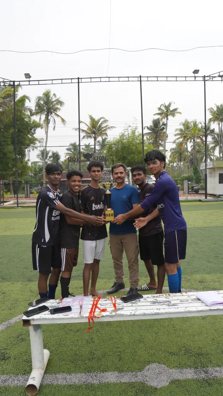 Players receiving the trophy after the final