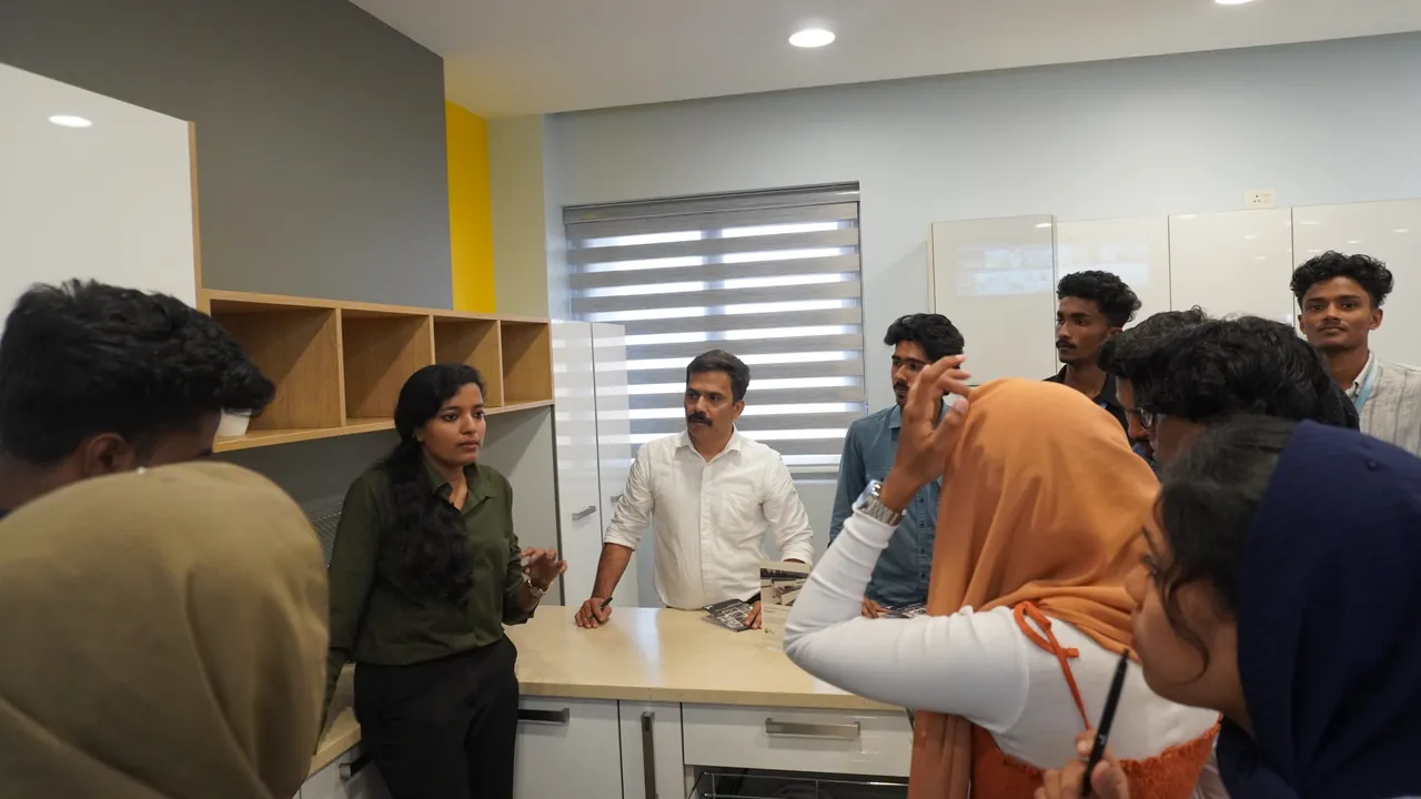 Students talking with a trainer in a showroom