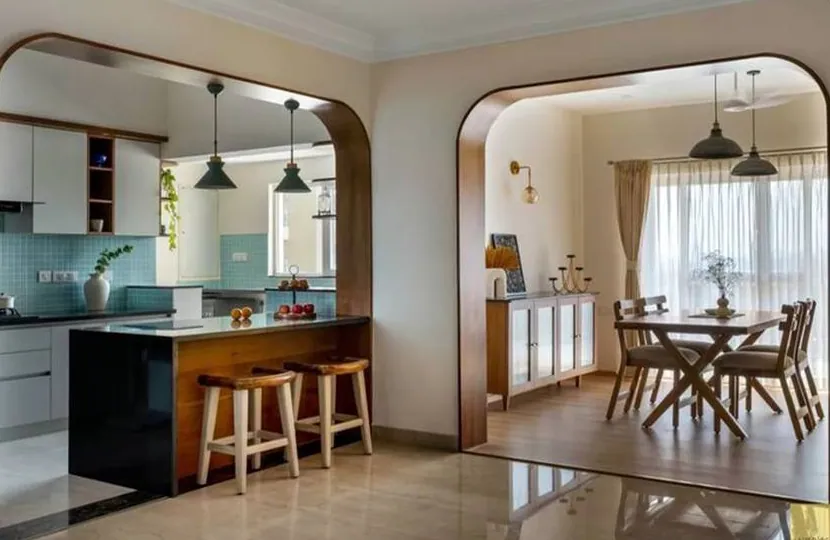 An open kitchen and dining room with arched openings