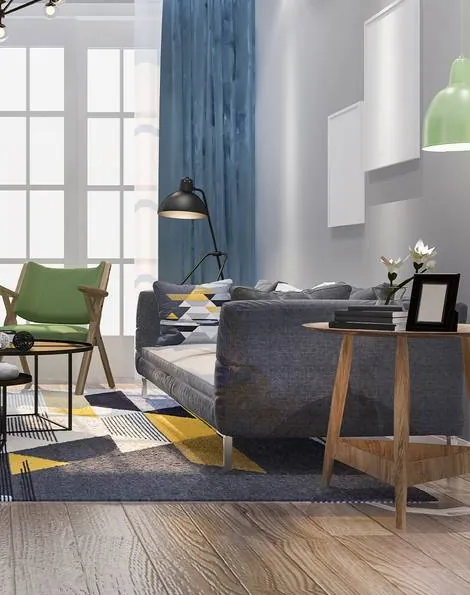 A grey and blue living room with a green armchair